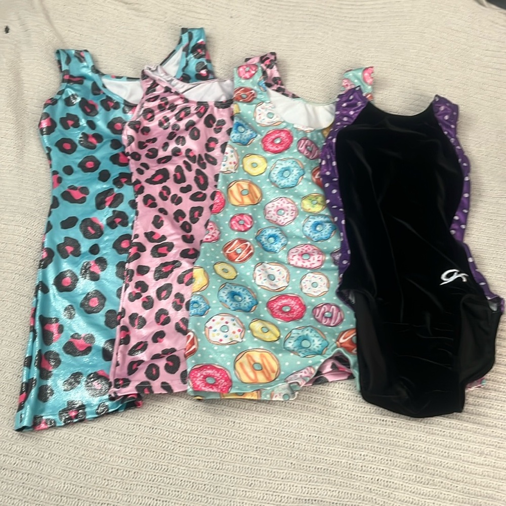 4 almost new gymnastics leotards size 8 and 10